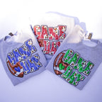 Three gray hoodies with 'GAME DAY' graphics in different colors (blue, red, green) and a football motif, arranged on a white background.