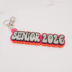 Keychain with 'Senior 2026' text on a white background by October House Co. in Hartville, Ohio.