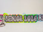 Neon Acrylic Keychain with 'Senior 2026' text by October House Co. in Hartville, Ohio.