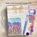 Ready-to-Paint Canvas Kit with lavender field design, paintbrushes, and paint tubes on a wooden surface by October House Co. in Hartville, Ohio. 