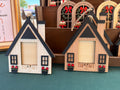 Wooden house-shaped ornaments with 'The Lake' 2025 Christmas Ornament by October House Co. in Hartville, Ohio.